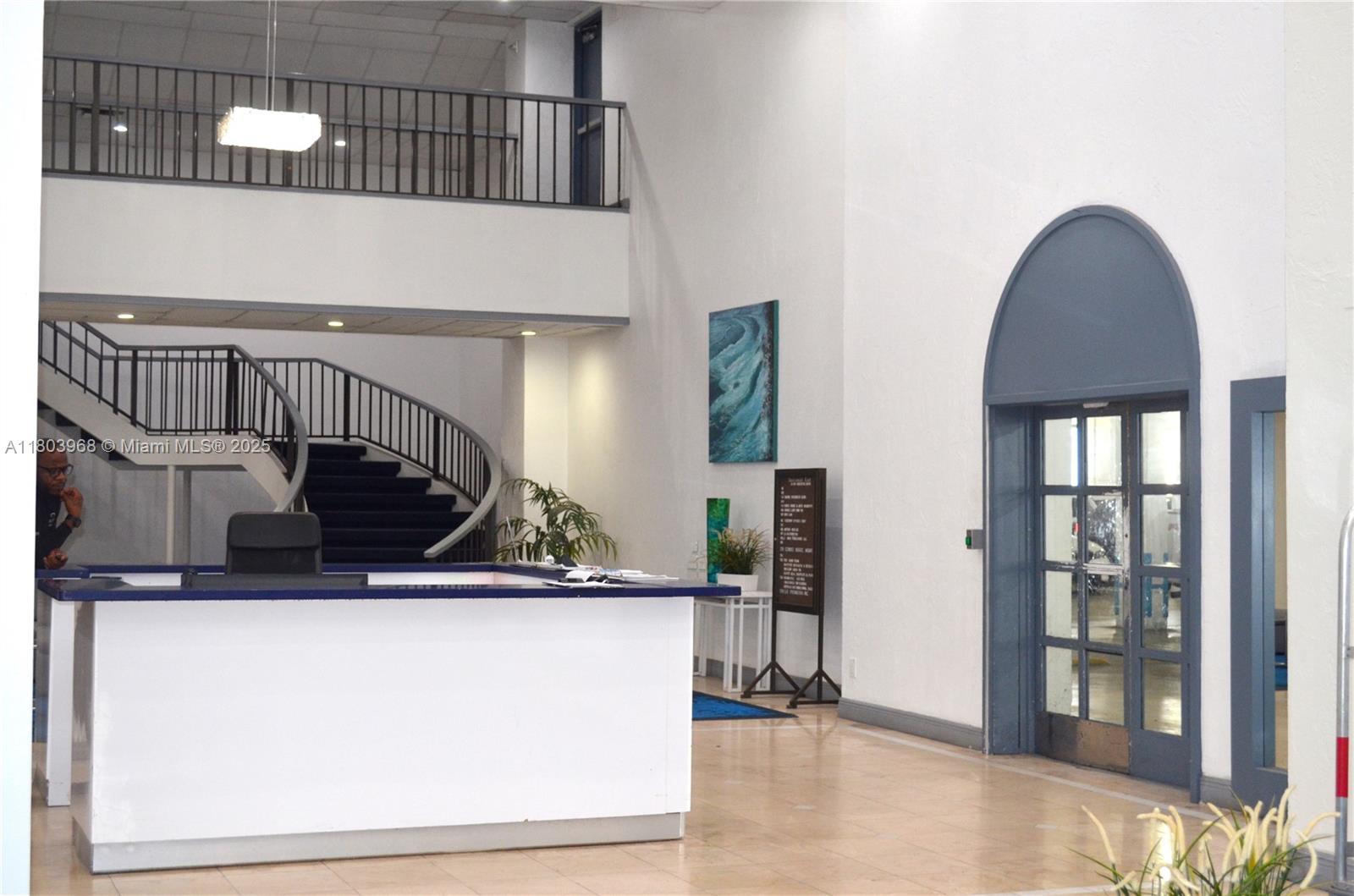 13499 Biscayne Boulevard, Unit 702 North Miami, FL 33181 - Photo 6 of 31 a kitchen with a sink and a refrigerator