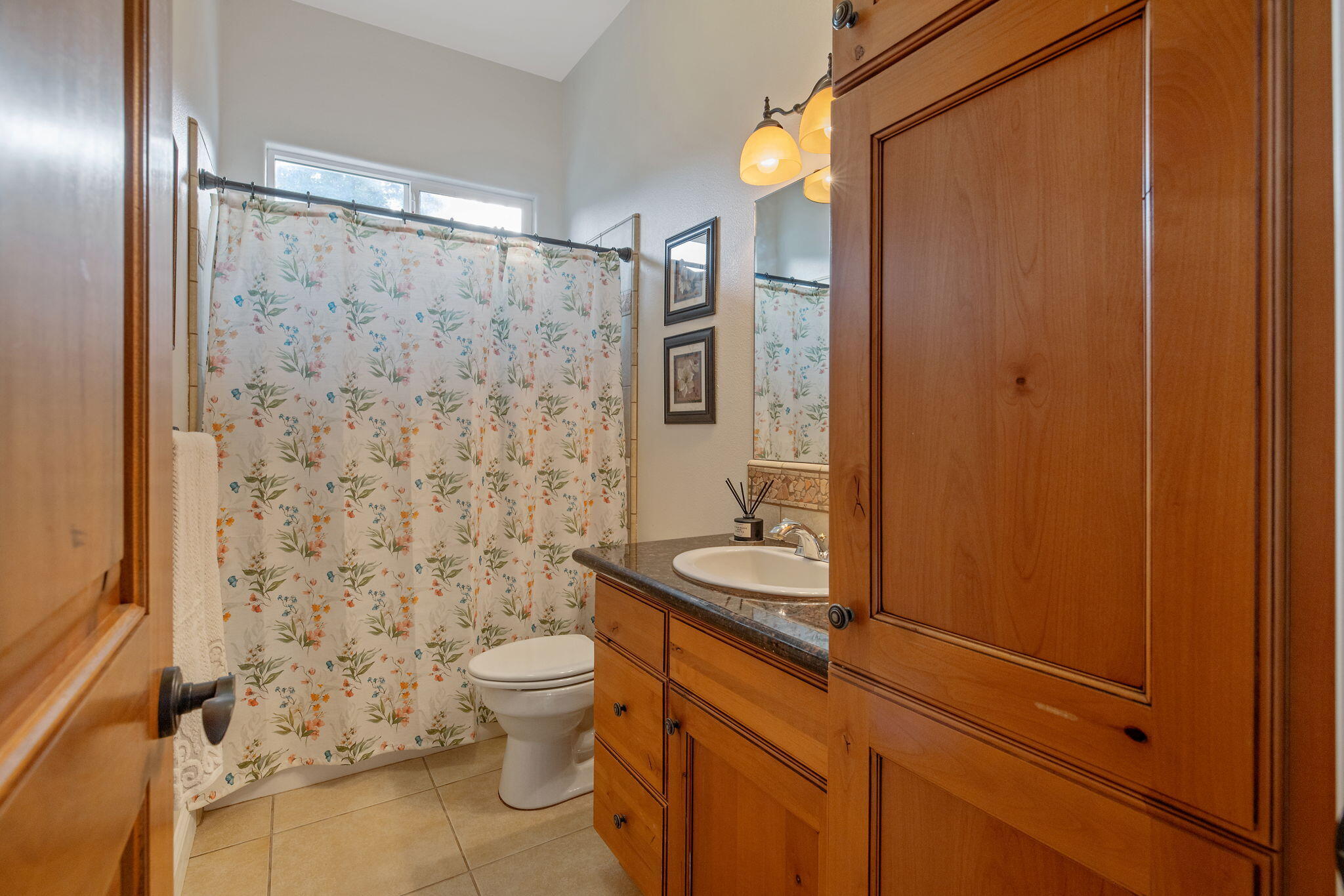 729 St Thomas Court Exeter, CA 93221 - Photo 28 of 66 a bathroom with a granite countertop sink toilet and shower