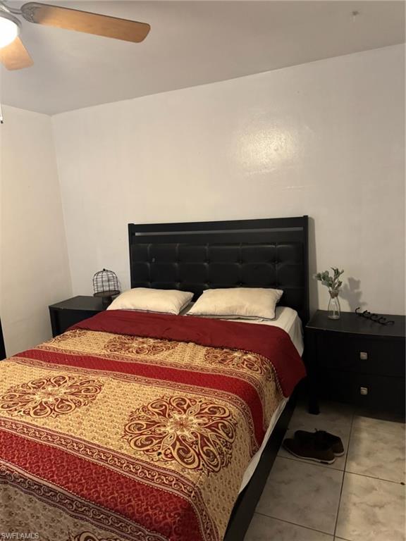 6300 Southwest 34th Court Miramar, FL 33023 - Photo 4 of 7 a bedroom with a bed and a night stand