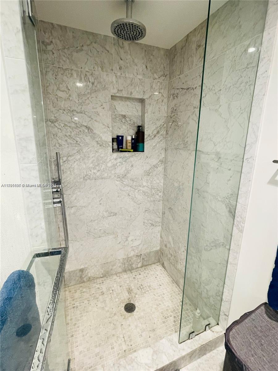 1000 Brickell Plaza, Unit 3905 Miami, FL 33131 - Photo 13 of 18 a bathroom with a shower
