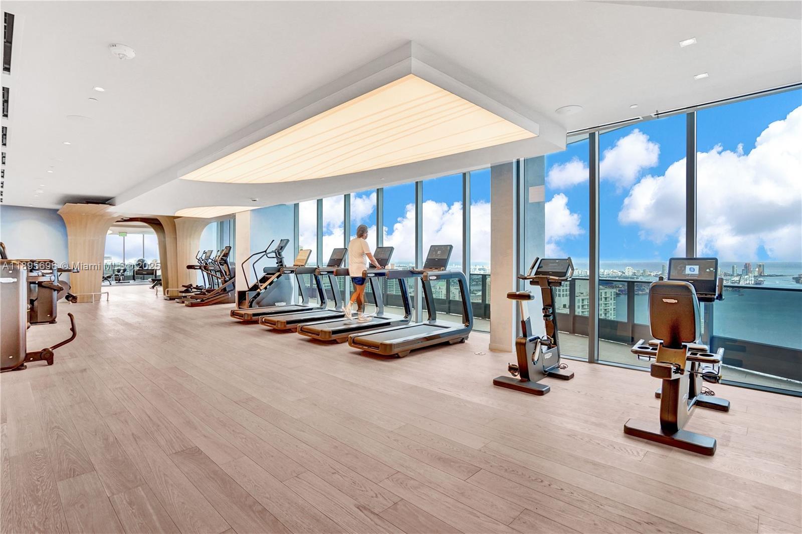 1000 Brickell Plaza, Unit 3905 Miami, FL 33131 - Photo 3 of 18 a view of a room with gym equipment