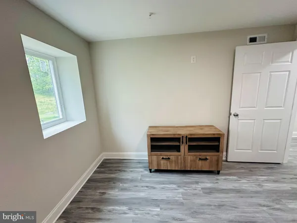a room with a bed and a window