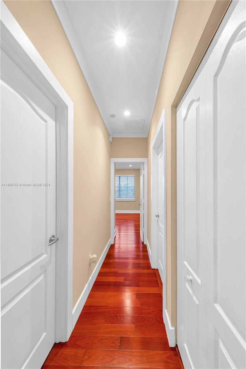 2829 Coconut Avenue, Unit 2829 Miami, FL 33133 - Photo 19 of 28 a view of a hallway with wooden floor