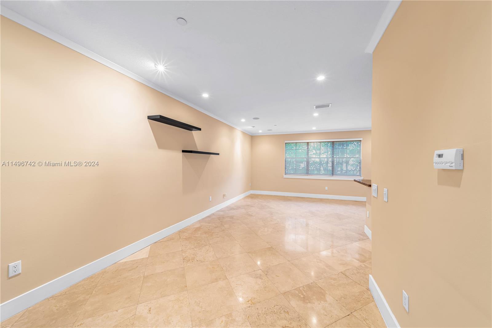 2829 Coconut Avenue, Unit 2829 Miami, FL 33133 - Photo 7 of 28 a view of an empty room with a window