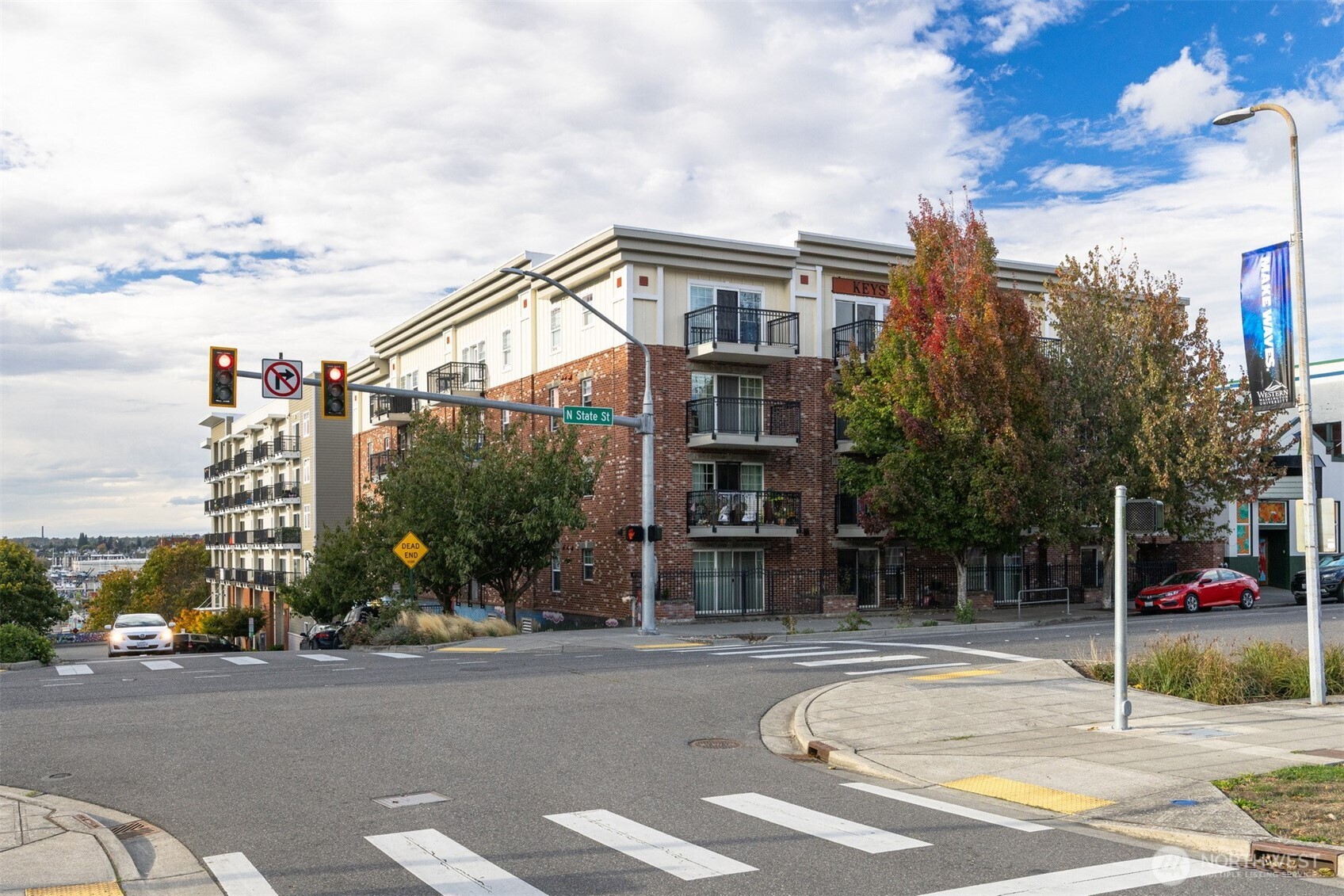 a view of a street with a building in the background