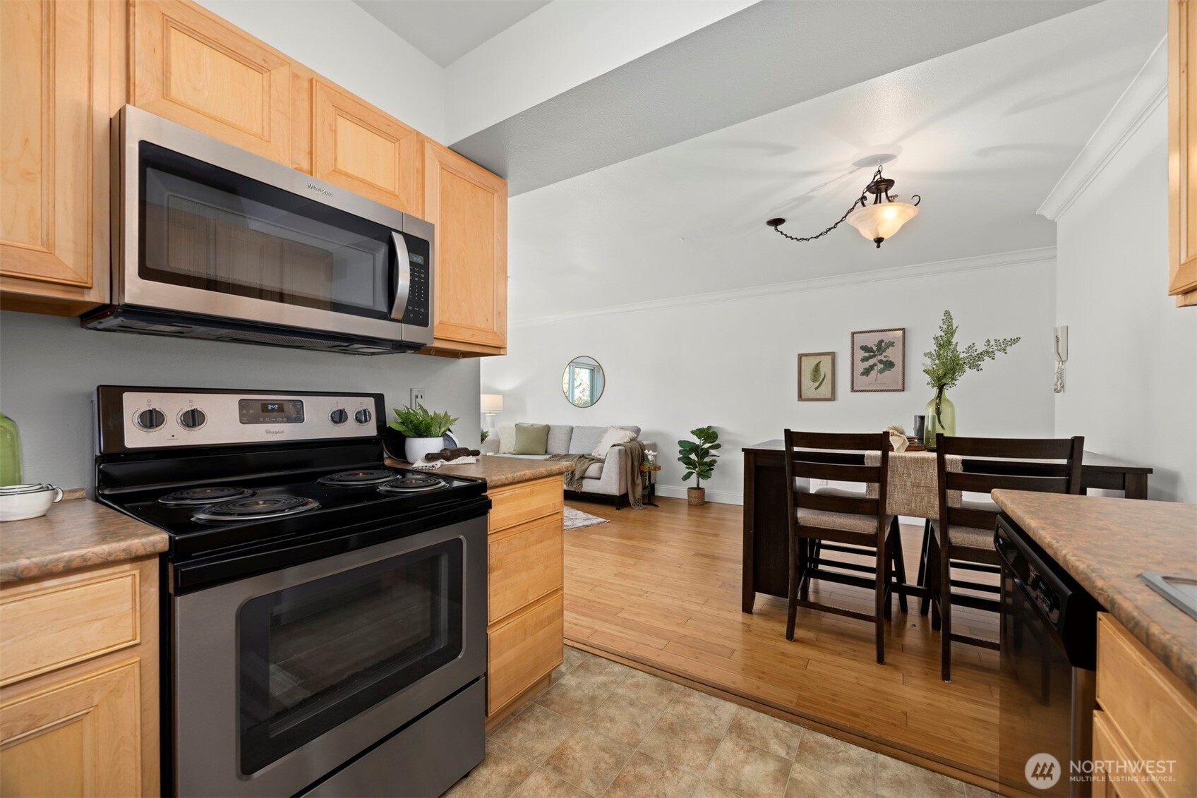 1001 North State Street, Unit 403 Bellingham, WA 98225 - Photo 18 of 34 a kitchen with stainless steel appliances a stove a microwave a sink and cabinets