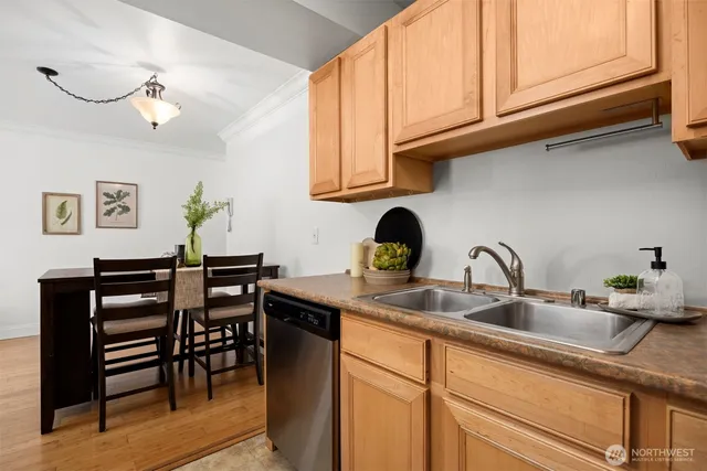 a kitchen with stainless steel appliances granite countertop a sink and cabinets