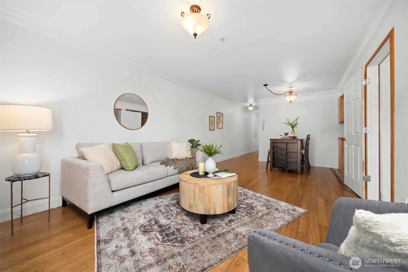 1001 North State Street, Unit 403 Bellingham, WA 98225 - Photo 26 of 34 a living room with furniture and a chandelier