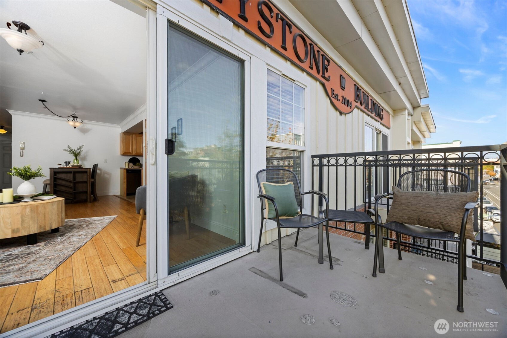 1001 North State Street, Unit 403 Bellingham, WA 98225 - Photo 31 of 34 a balcony with chairs and a table