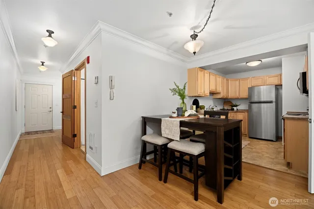 a view of a dining room with furniture window and wooden floor