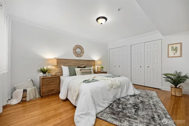 a bedroom with a bed and a table