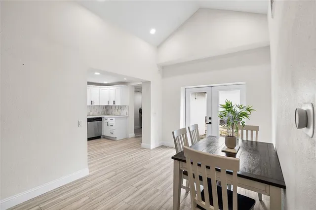 a dining room with furniture and wooden floor