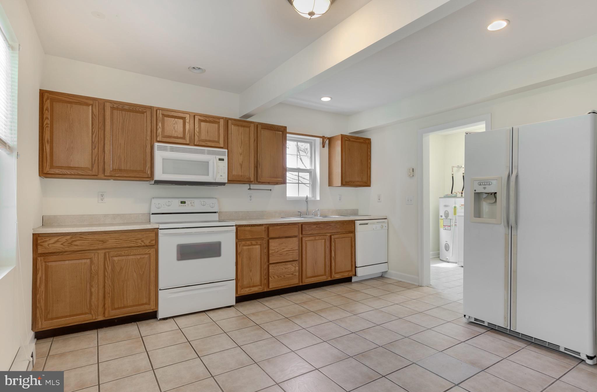 202 West Railroad Street Ridgely, MD 21660 - Photo 7 of 30 Eat in Country Kitchen flows to utility and bath