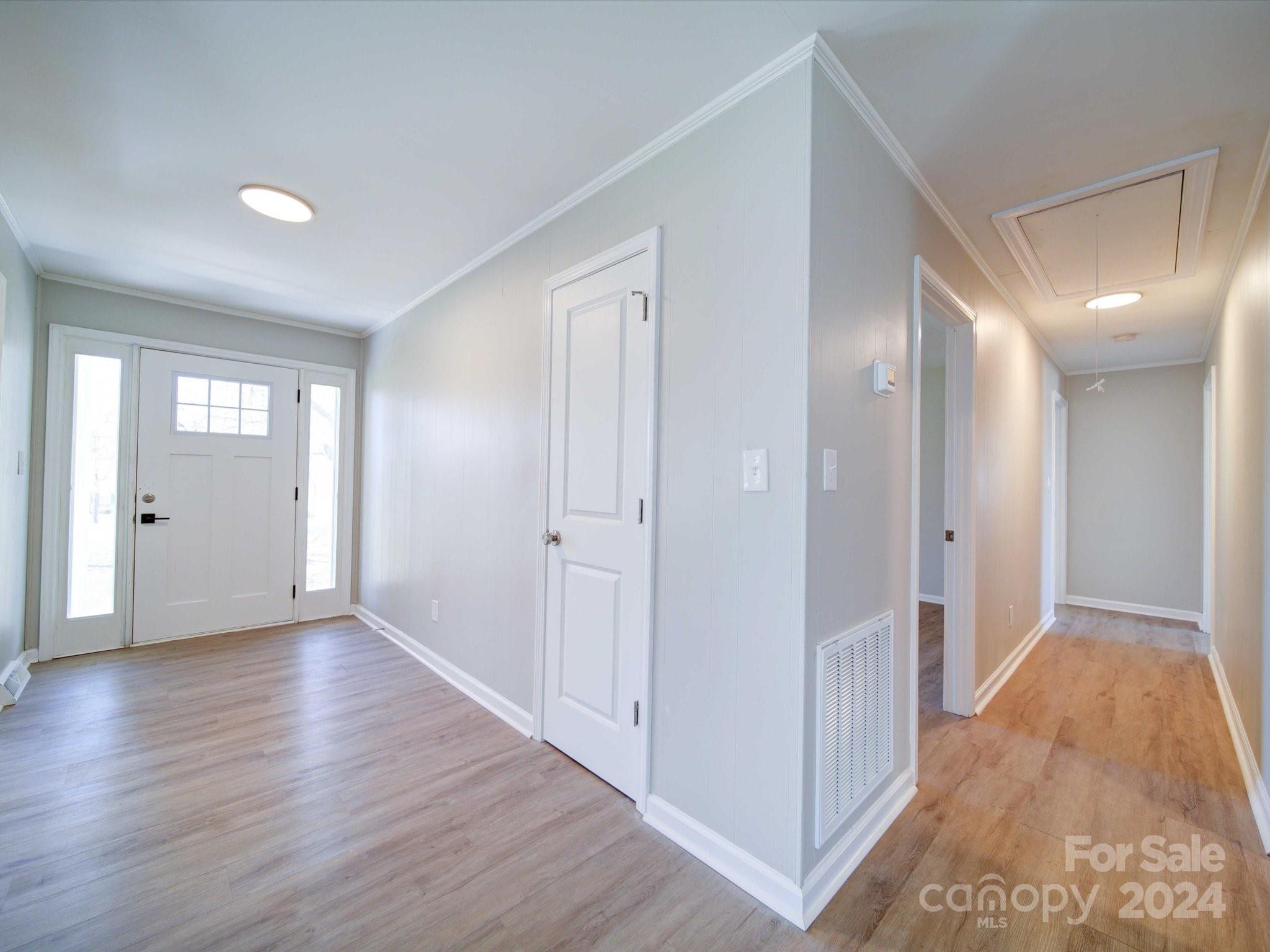 101 Hedgestone Drive Gastonia, NC 28056 - Photo 11 of 39 a view of hallway with bathroom and wooden floor