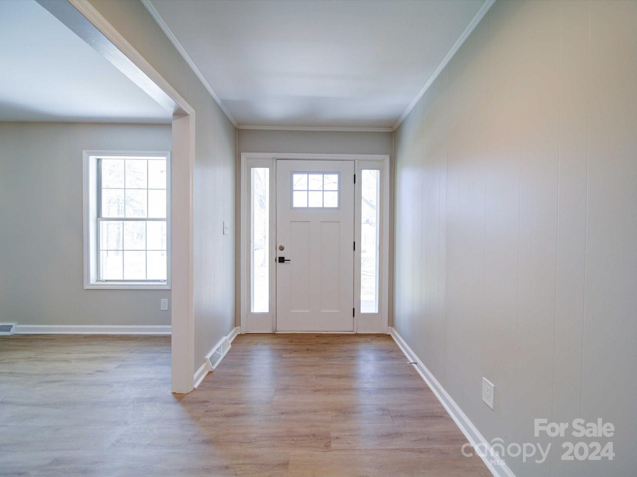 101 Hedgestone Drive Gastonia, NC 28056 - Photo 12 of 39 a view of an empty room with wooden floor and a window