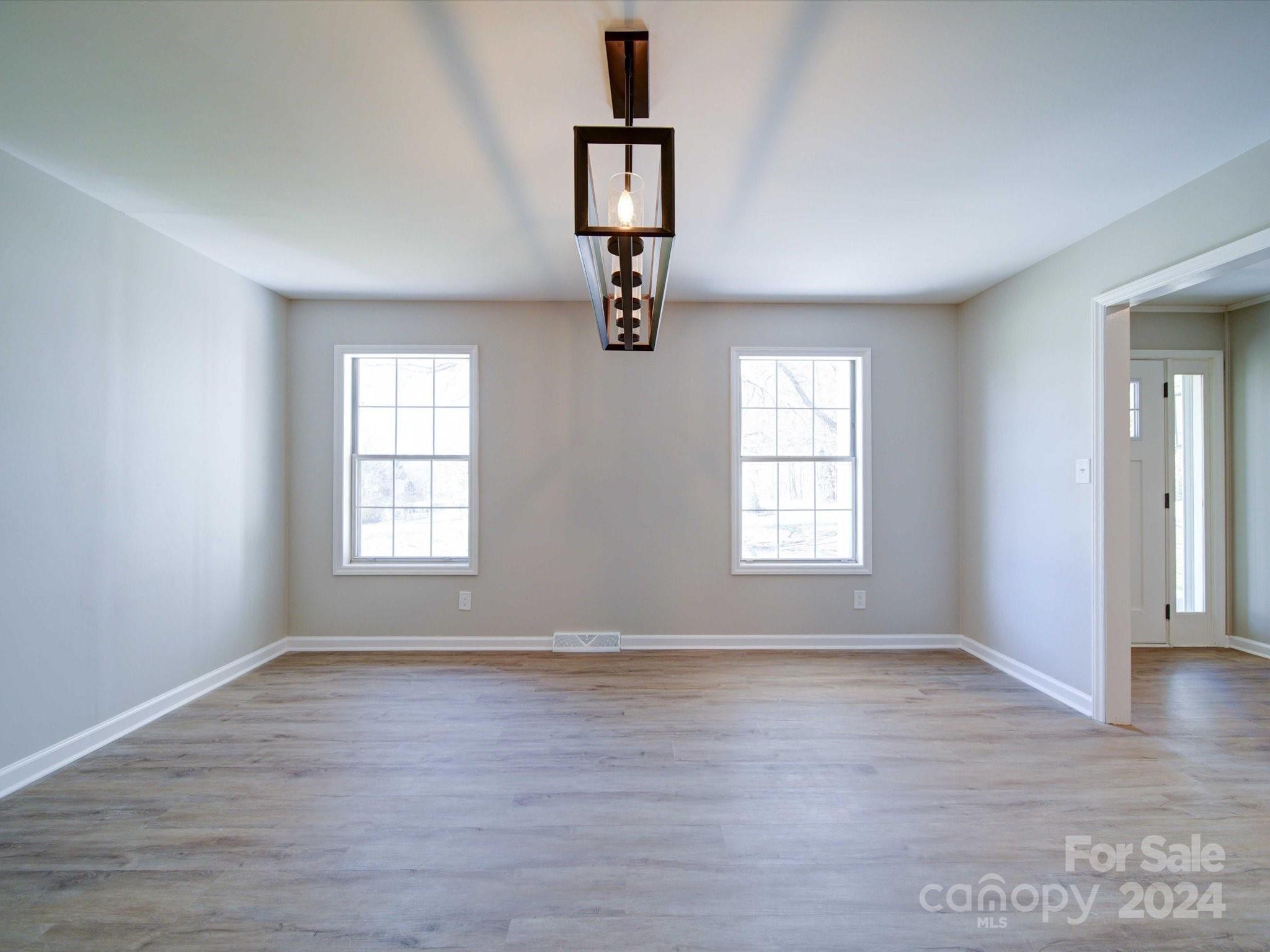 101 Hedgestone Drive Gastonia, NC 28056 - Photo 14 of 39 wooden floor in an empty room with a window