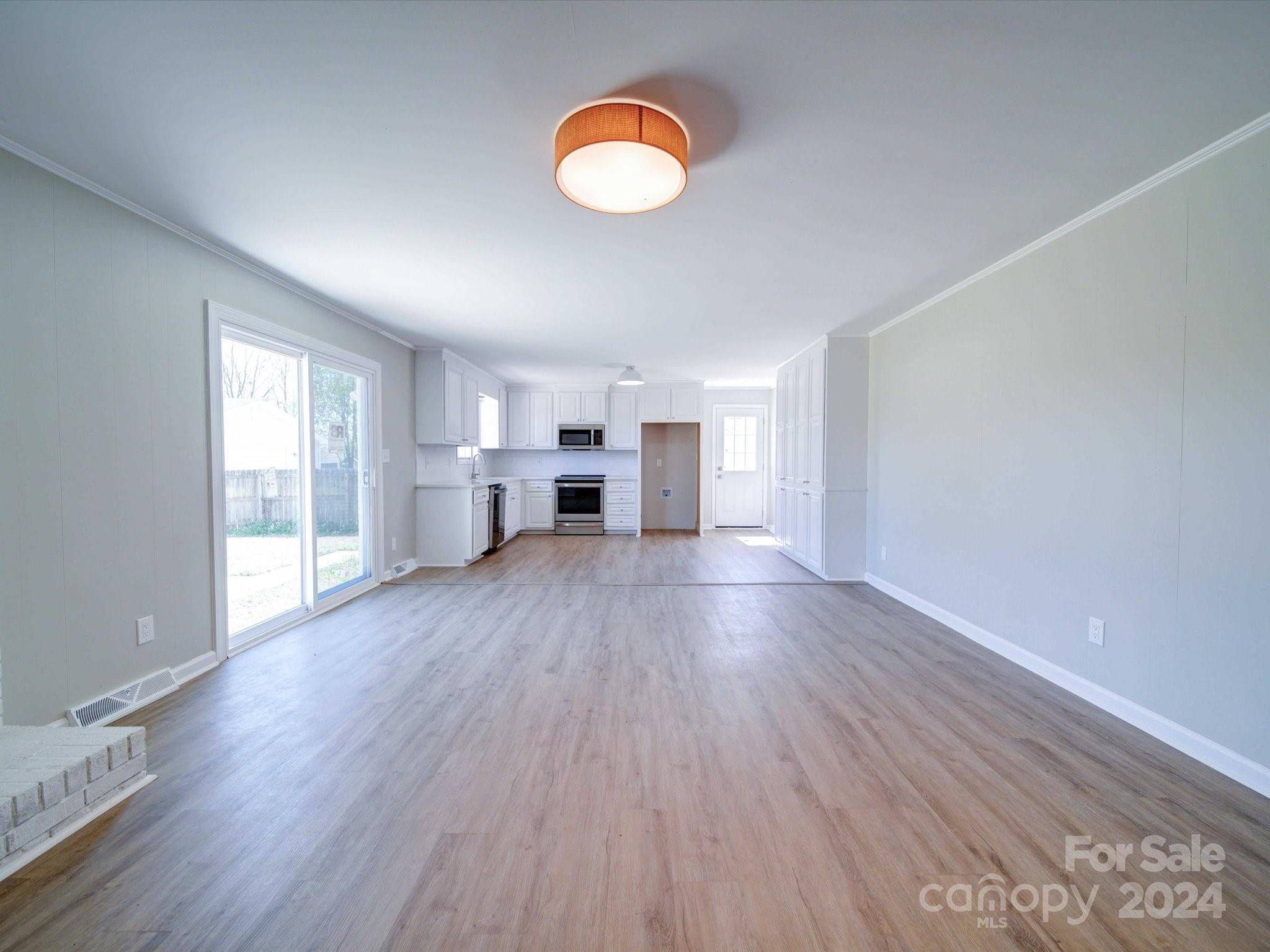 101 Hedgestone Drive Gastonia, NC 28056 - Photo 20 of 39 a view of empty room with wooden floor and window