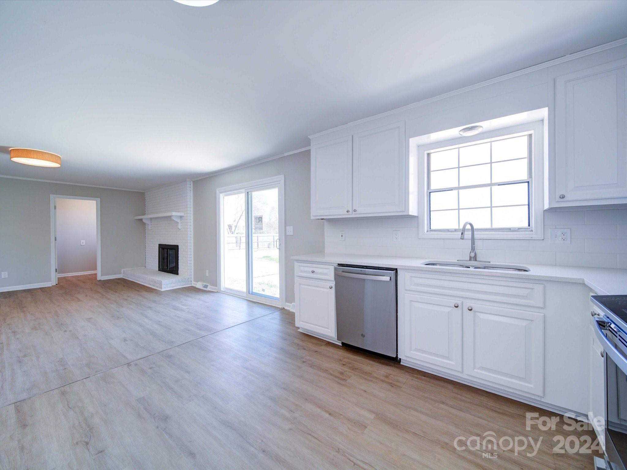 101 Hedgestone Drive Gastonia, NC 28056 - Photo 23 of 39 a kitchen with granite countertop a sink and a stove top oven