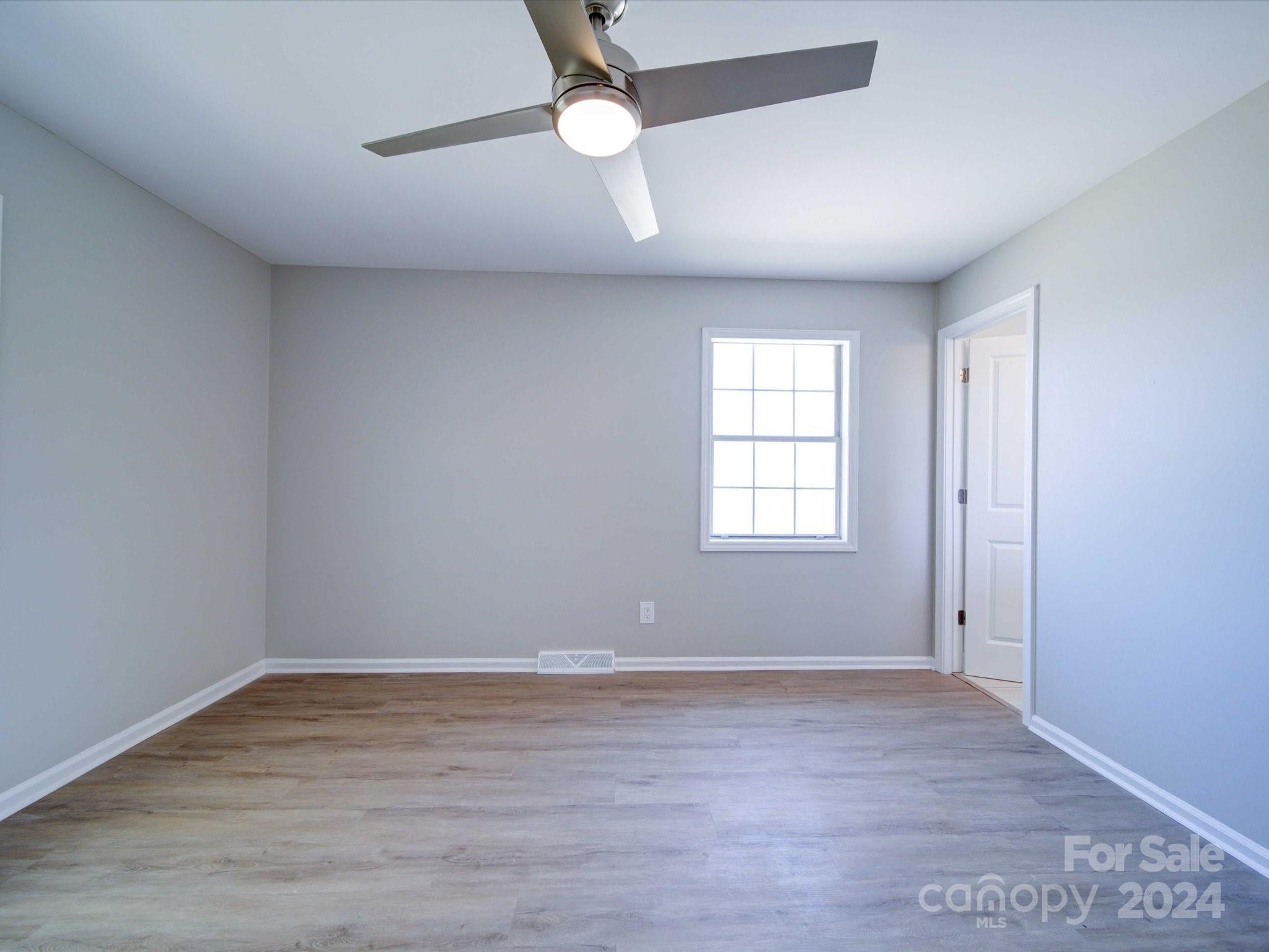 101 Hedgestone Drive Gastonia, NC 28056 - Photo 29 of 39 wooden floor in an empty room with a window