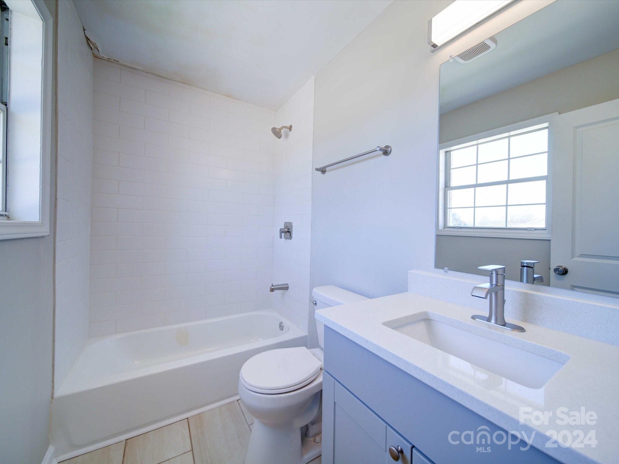 101 Hedgestone Drive Gastonia, NC 28056 - Photo 30 of 39 a bathroom with a sink a toilet and shower