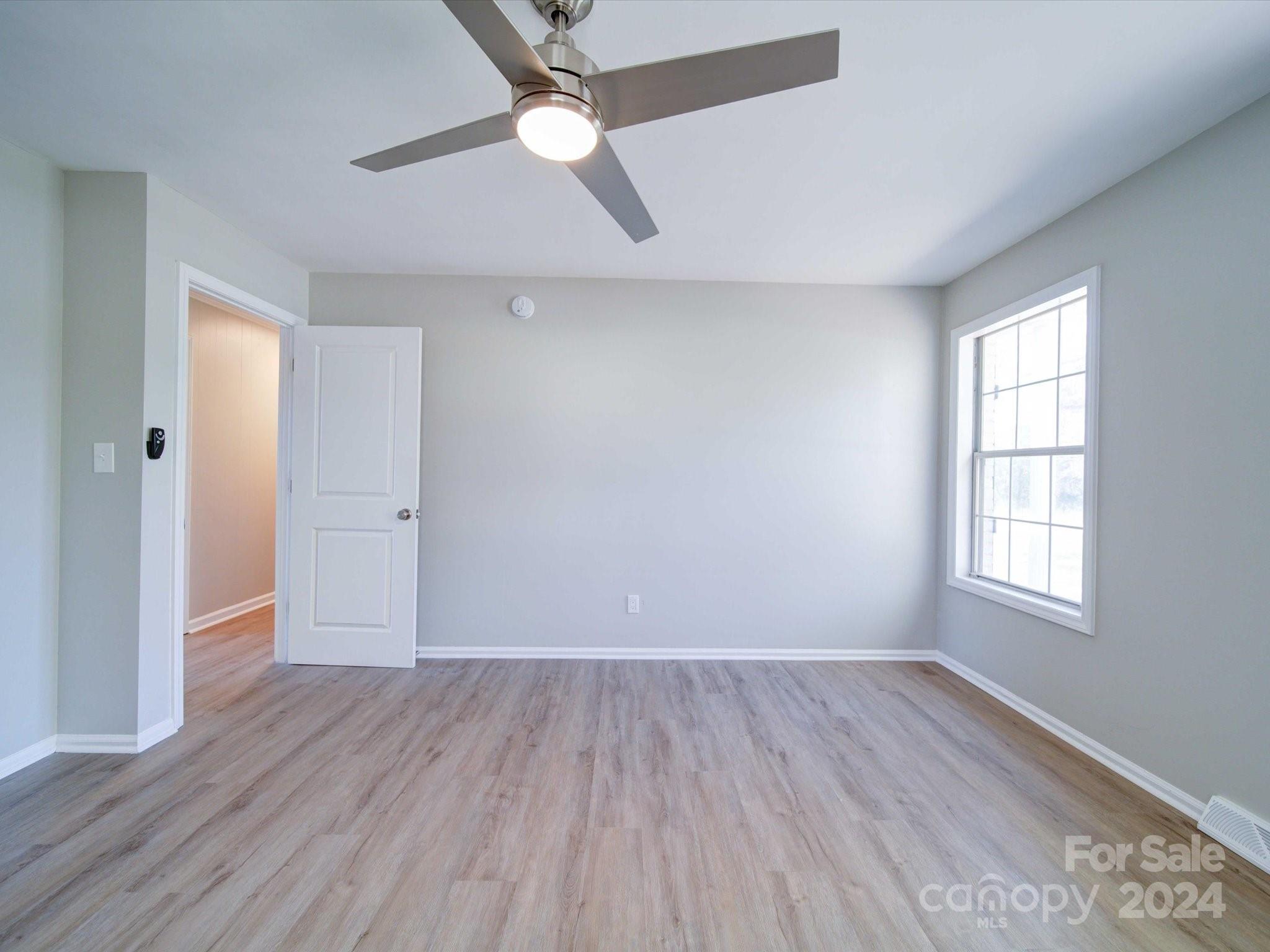 101 Hedgestone Drive Gastonia, NC 28056 - Photo 34 of 39 wooden floor in an empty room with a window