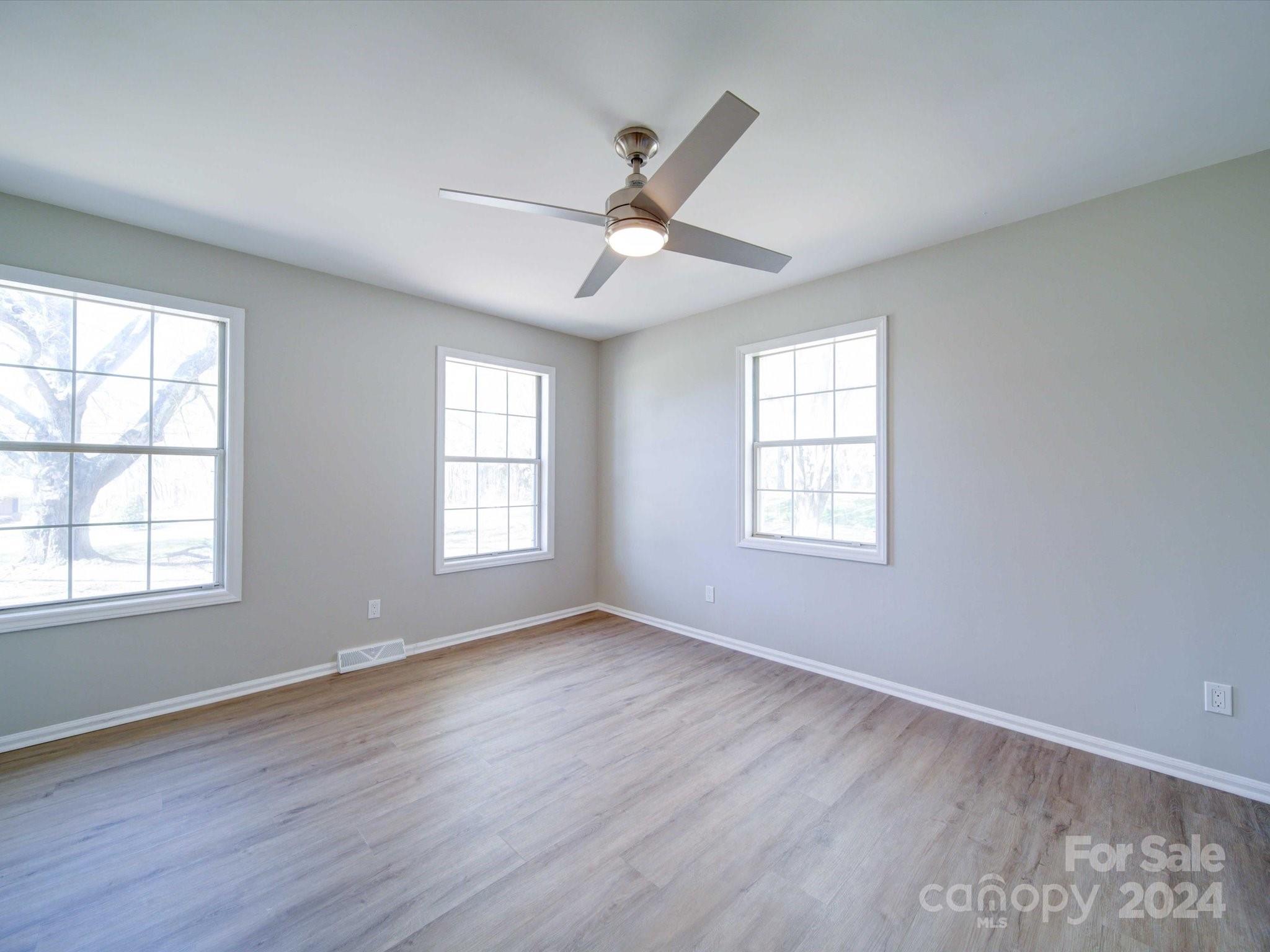 101 Hedgestone Drive Gastonia, NC 28056 - Photo 35 of 39 a view of an empty room with wooden floor and a window