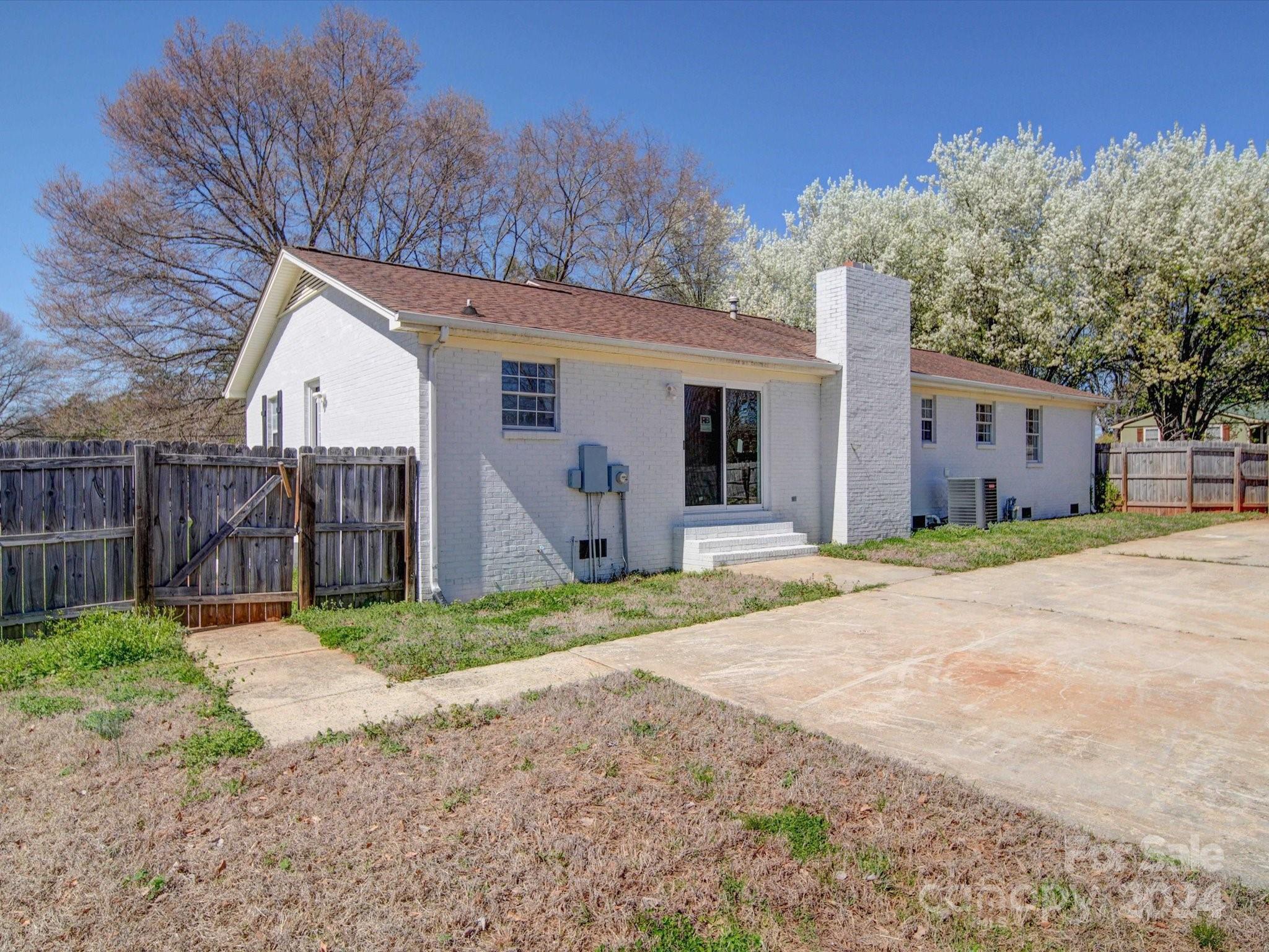 101 Hedgestone Drive Gastonia, NC 28056 - Photo 4 of 39 a house with trees in the background
