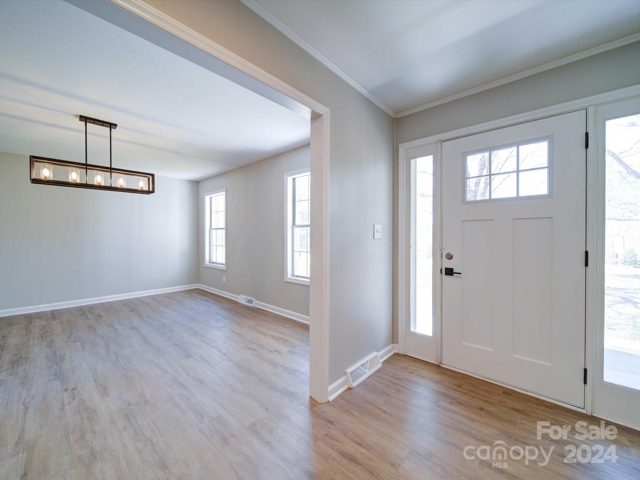 101 Hedgestone Drive Gastonia, NC 28056 - Photo 10 of 39 an empty room with wooden floor and windows