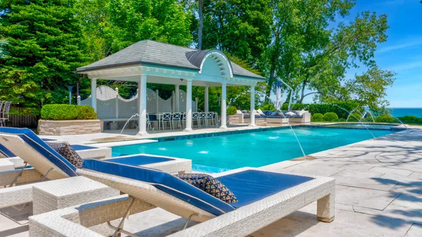 a view of an house with backyard porch and patio