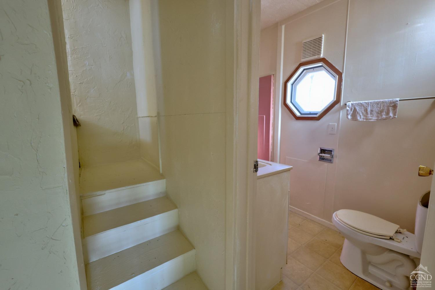 360 Stone Bridge Rd Extension East Durham, NY 12423 - Photo 48 of 83 a bathroom with a toilet and a mirror