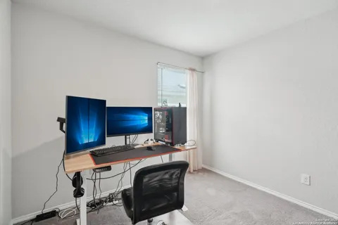 a room with a table and chairs