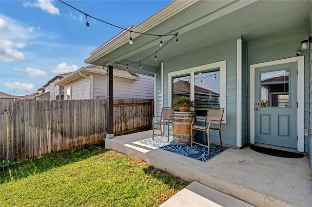 a view of backyard with seating space