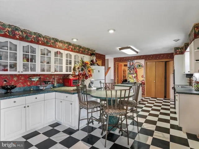 a kitchen with a stove and a refrigerator