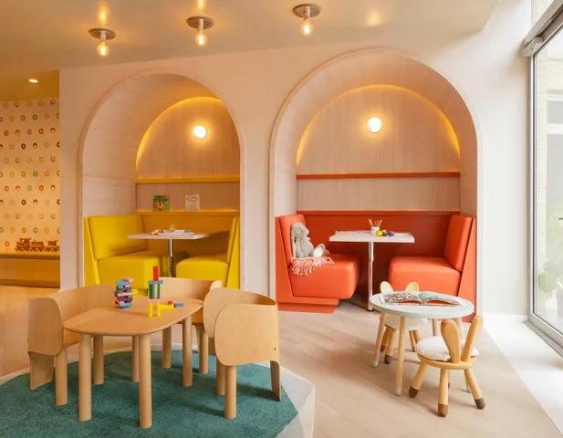 a dining room with furniture and wooden floor