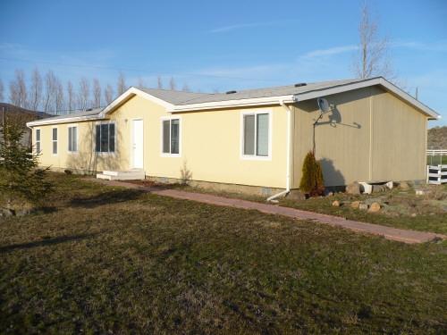1283 Potter Road Tieton, WA 98947 - Photo 1 of 8 a view of a house with backyard