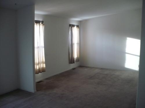 1283 Potter Road Tieton, WA 98947 - Photo 3 of 8 an empty room that has windows in it