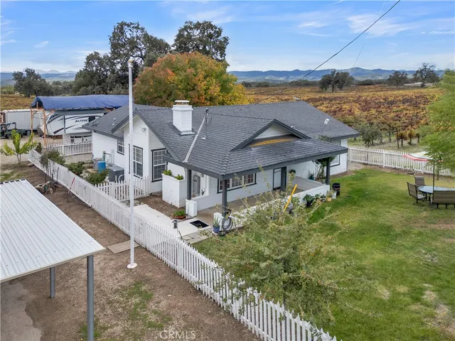 a view of a house with a yard from a balcony