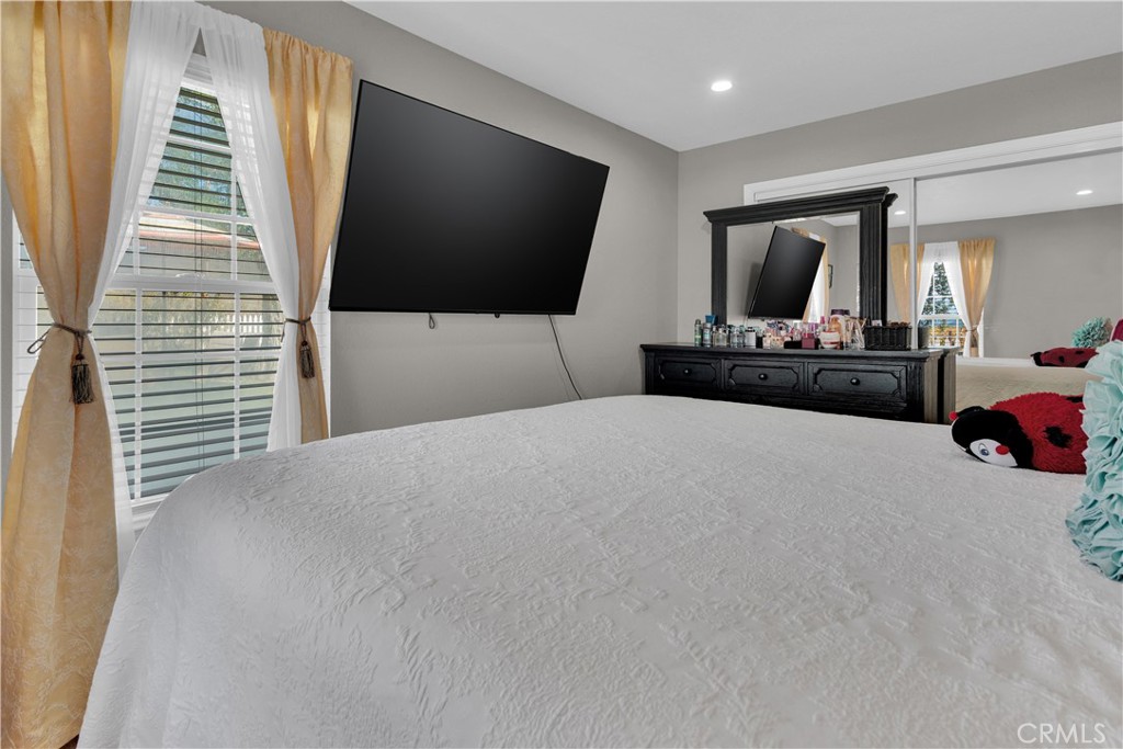 53500 Bradley Lockwood Road Bradley, CA 93426 - Photo 14 of 30 a bedroom with furniture and a flat screen tv