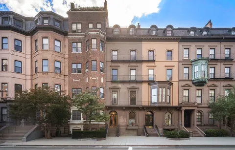 a front view of a building with balcony