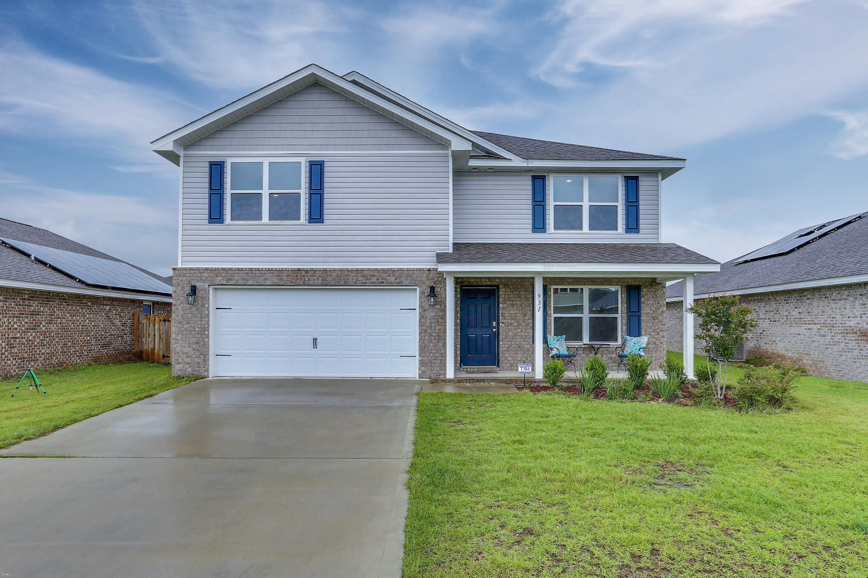 931 Merganser Way Crestview, FL 32539 - Photo 1 of 39 a front view of a house with garden