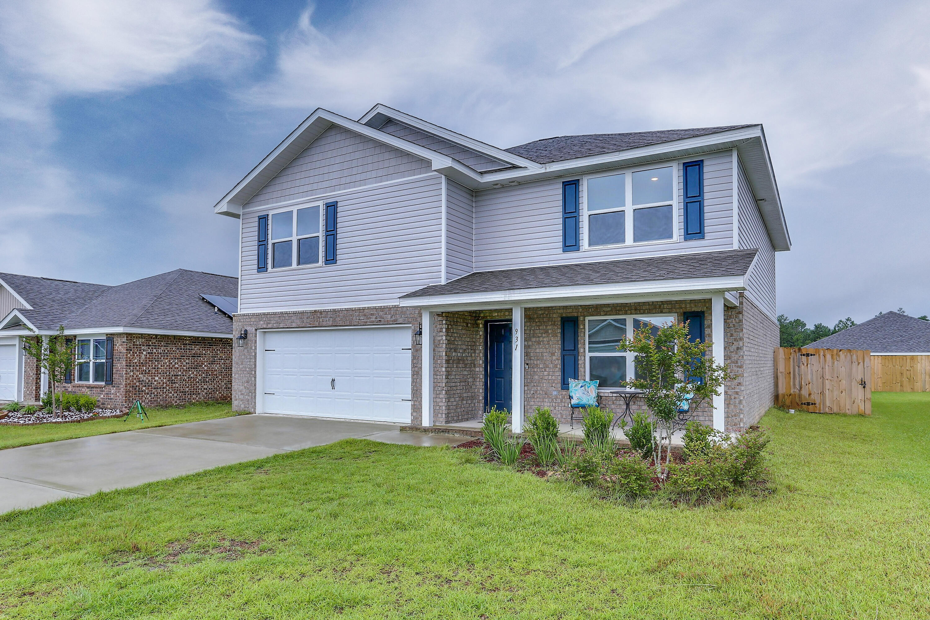 931 Merganser Way Crestview, FL 32539 - Photo 2 of 39 a view of a yard in front of a house