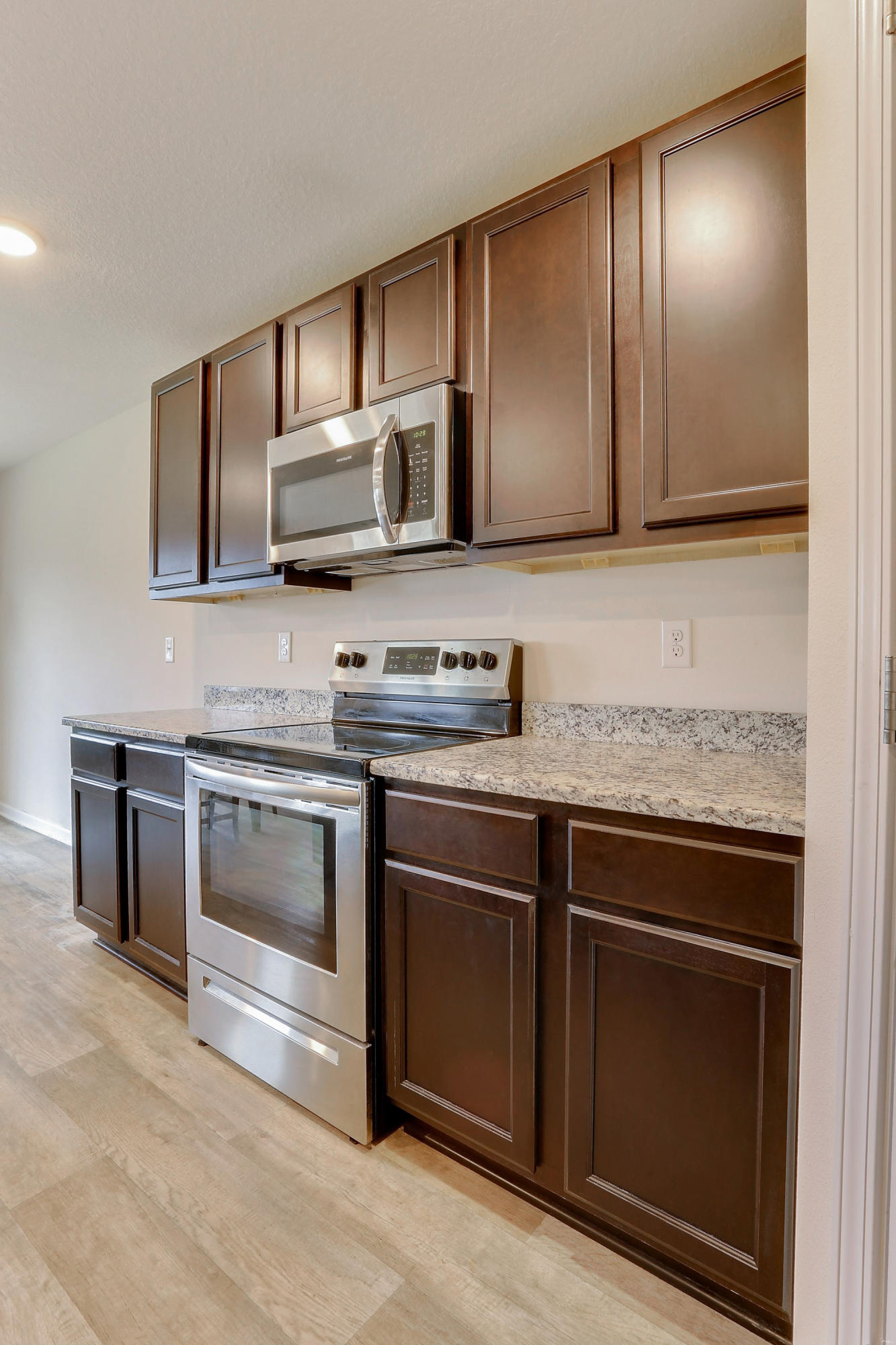 931 Merganser Way Crestview, FL 32539 - Photo 12 of 39 a kitchen with granite countertop stainless steel appliances and cabinets