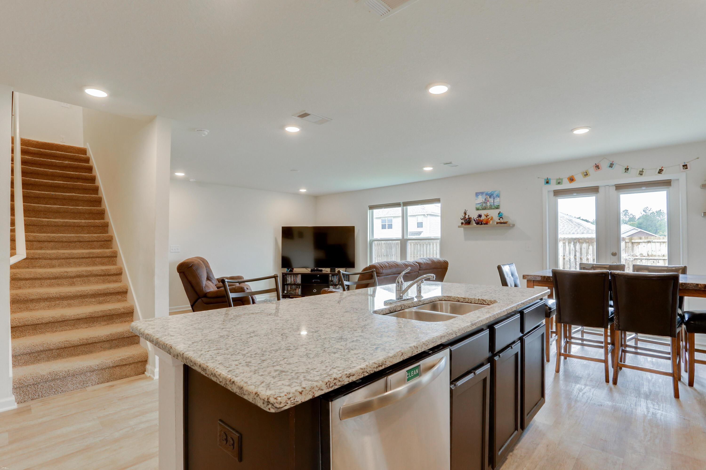 931 Merganser Way Crestview, FL 32539 - Photo 14 of 39 a kitchen with granite countertop a table and chairs in it