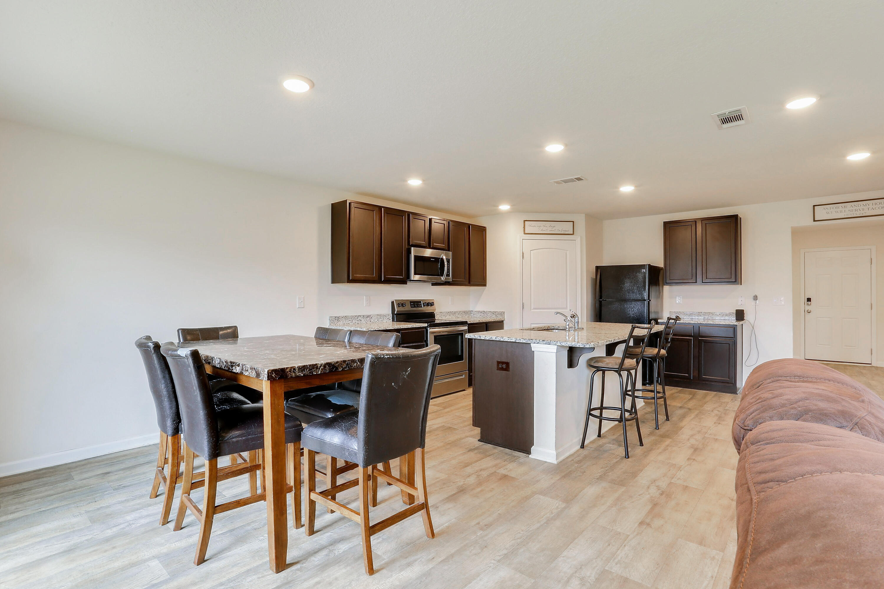 931 Merganser Way Crestview, FL 32539 - Photo 16 of 39 a view of a dining room with furniture kitchen and wooden floor