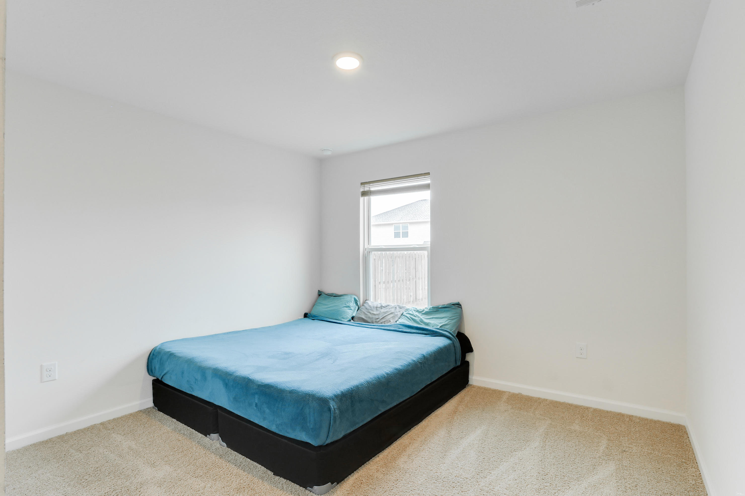 931 Merganser Way Crestview, FL 32539 - Photo 19 of 39 a bedroom with a bed and window