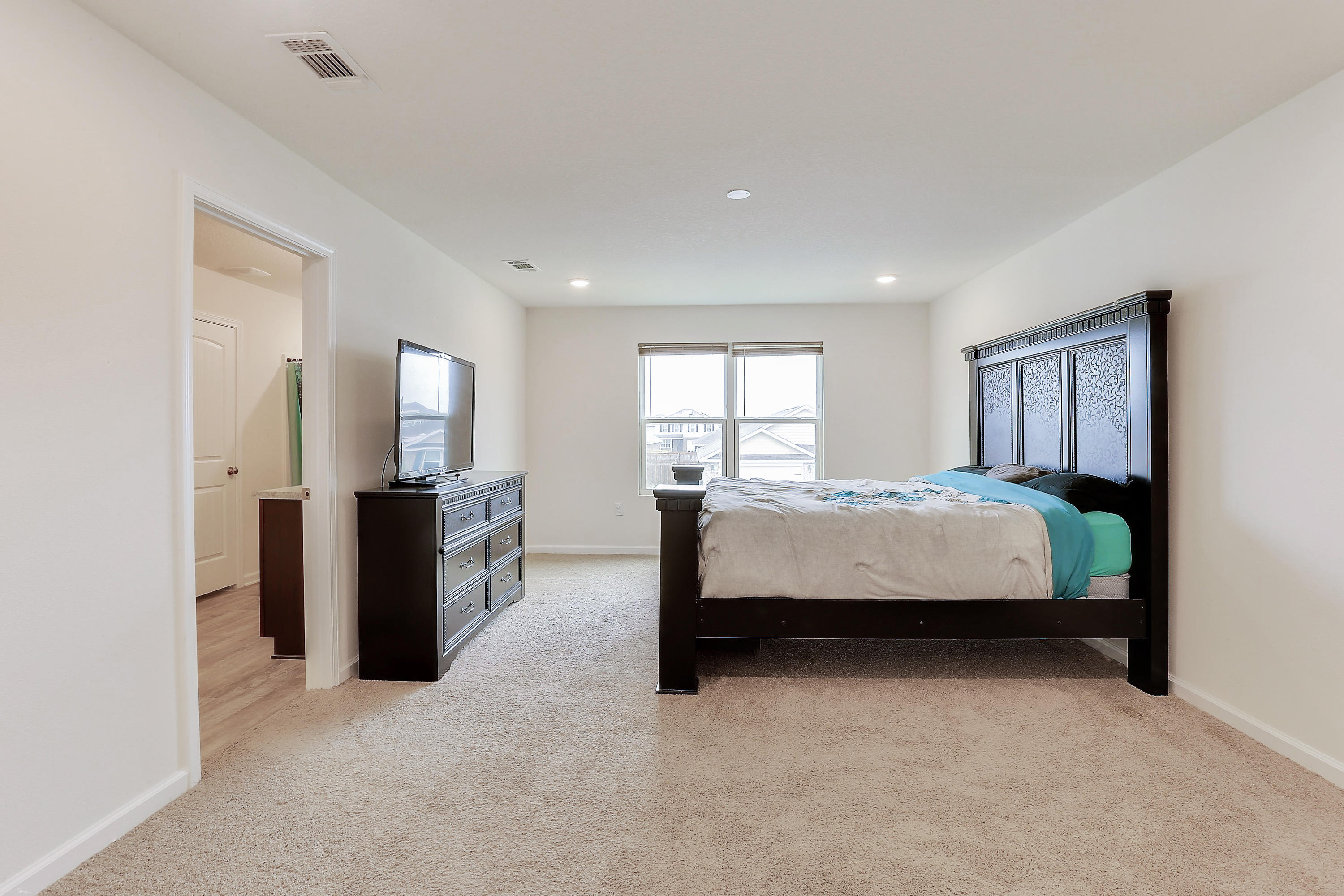 931 Merganser Way Crestview, FL 32539 - Photo 24 of 39 a bed room with a bed window and mirror