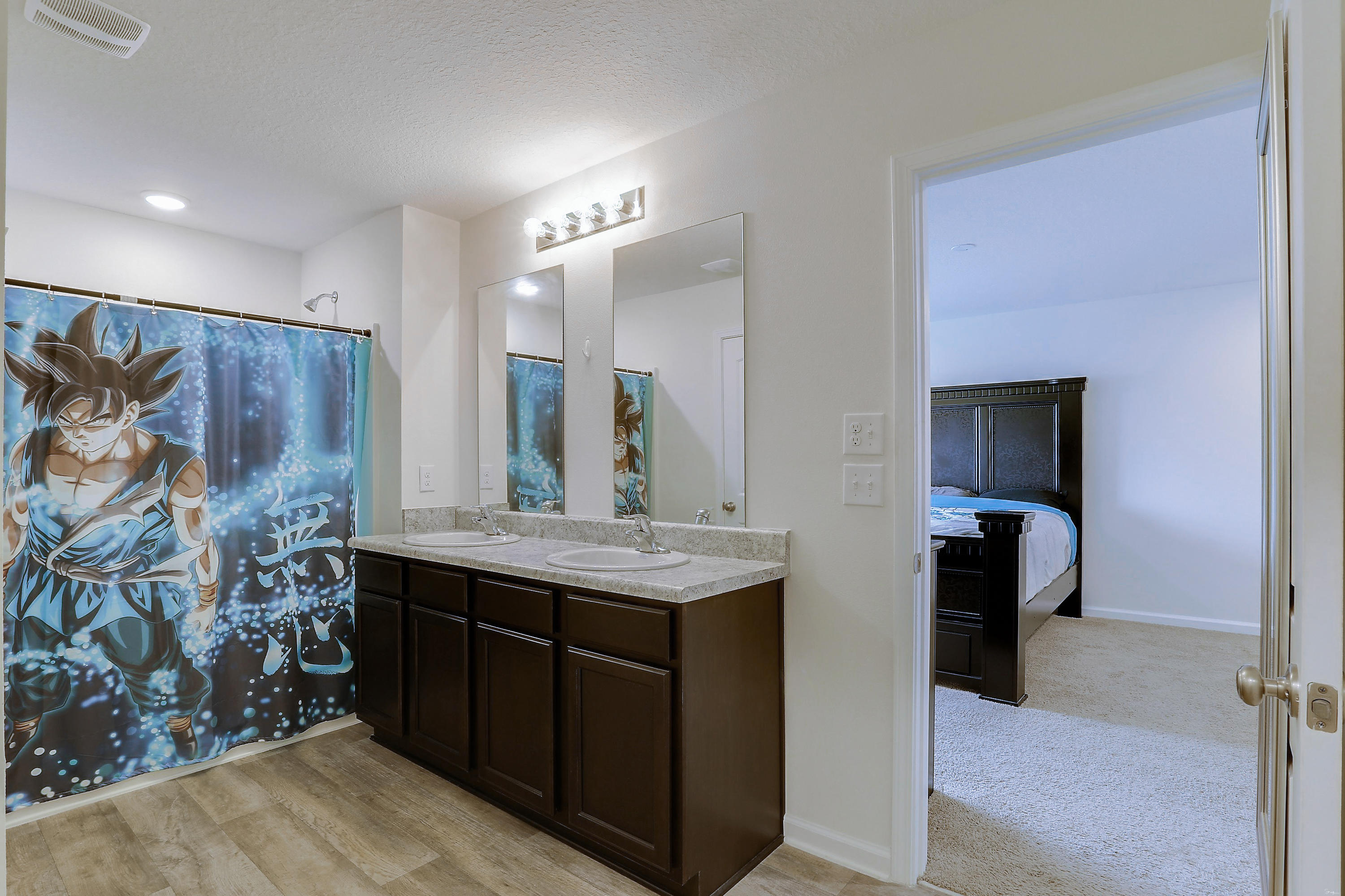 931 Merganser Way Crestview, FL 32539 - Photo 28 of 39 a bathroom with a sink and a mirror