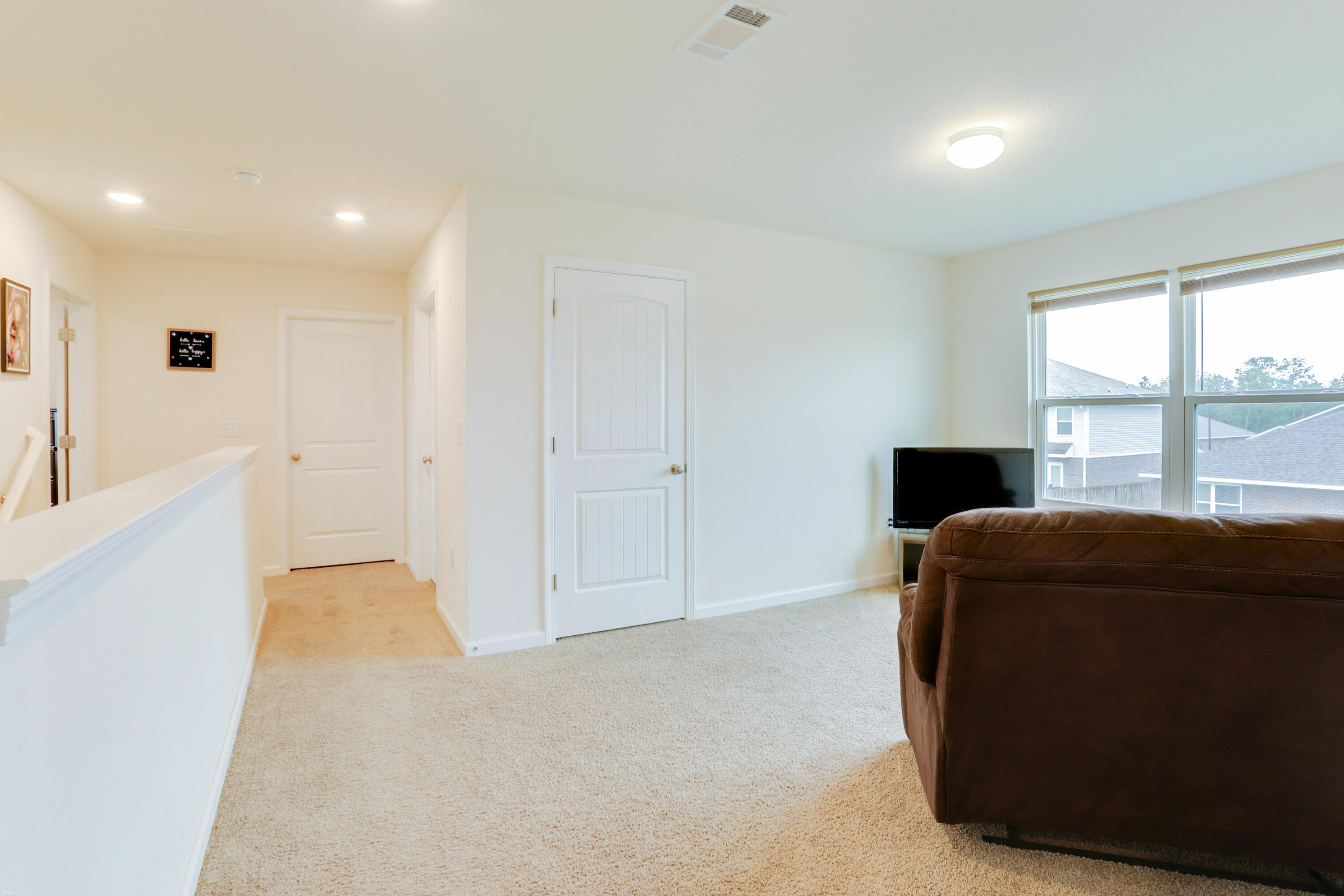 931 Merganser Way Crestview, FL 32539 - Photo 31 of 39 a living room with furniture and a large window