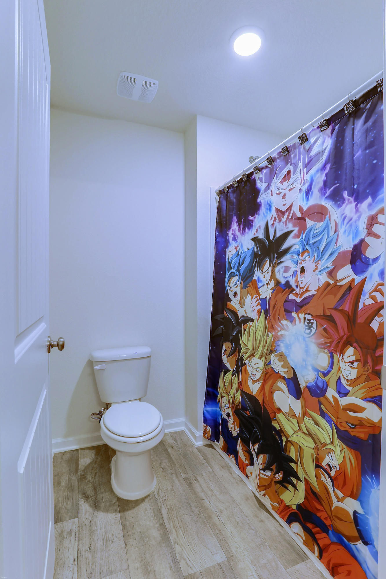 931 Merganser Way Crestview, FL 32539 - Photo 36 of 39 a bathroom with a toilet and a shower curtain