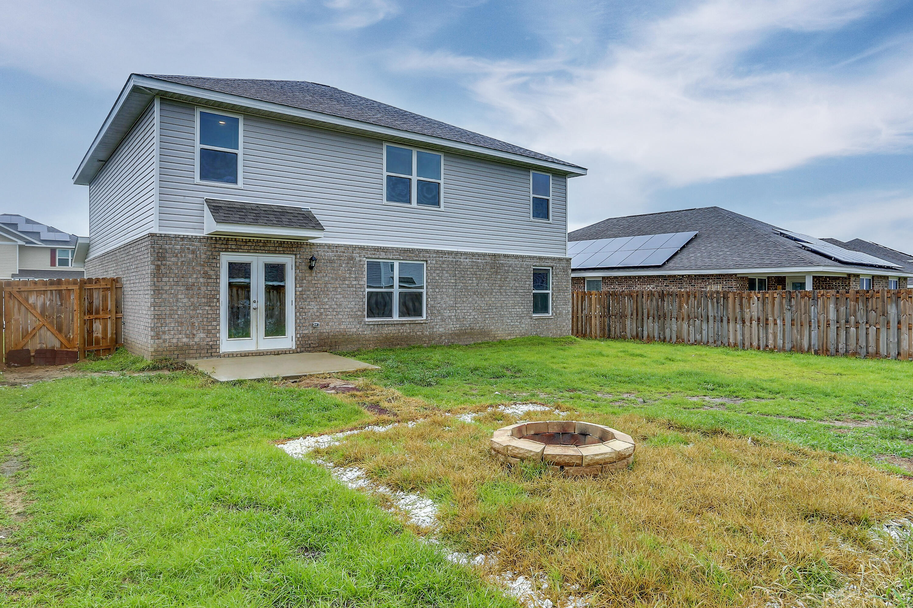931 Merganser Way Crestview, FL 32539 - Photo 39 of 39 a view of a house with a backyard and a tree